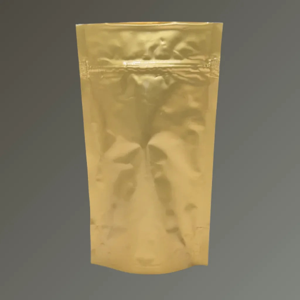 Gold resealable stand up pouch with heat-sealable top, displayed upright against a grey background.