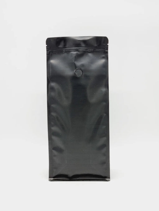 Recyclable, resealable flat bottom coffee pouch with side gusset and a one way valve.