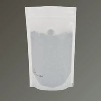 Recyclable matt white stand up coffee pouch with open top and one-way valve, displayed upright against a grey background.