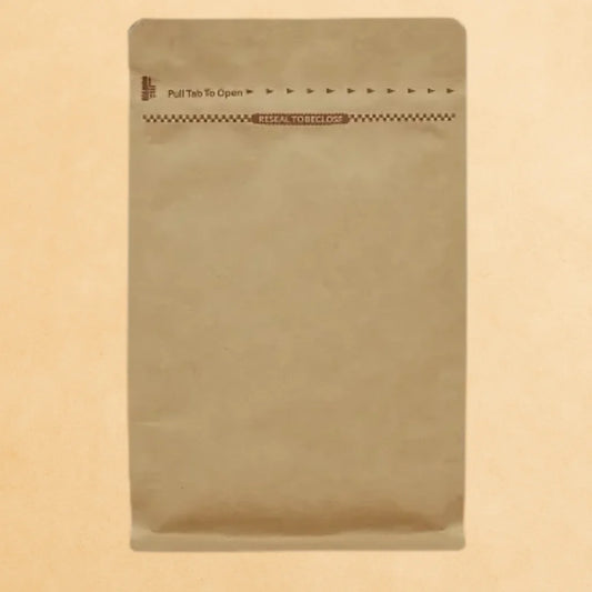 Brown Kraft coffee pouch with Rip n Zip opening and resealable closure, displayed upright against a beige background.