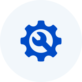Blue gear icon with a wrench inside on a white background