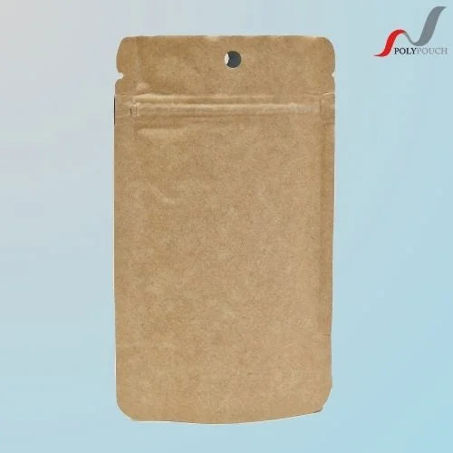 Brown kraft resealable stand up pouch with a euro slot, displayed upright against a light blue background with the Polypouch logo in the top right corner.