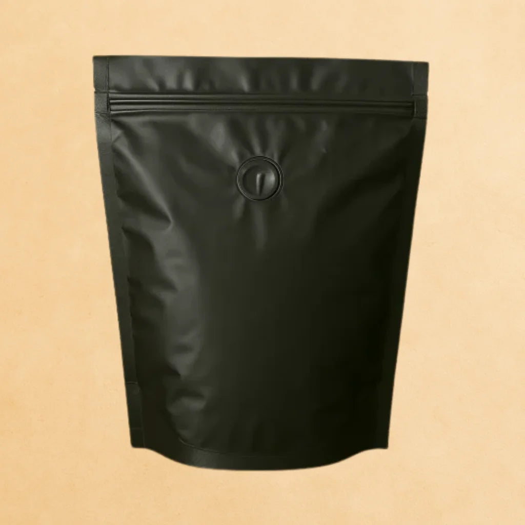 Back view of a lack stad up resealable coffee pouch with a degassing valve.