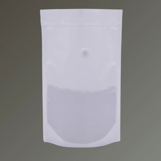 White recyclable stand up coffee pouch with valve and resealable zipper, shown upright against a grey background.