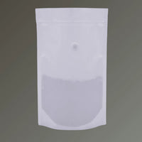 White recyclable stand up coffee pouch with valve and resealable zipper, shown upright against a grey background.