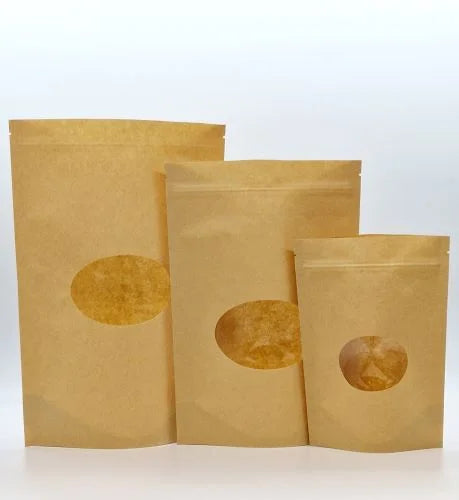 3 different sized kraft pouches with a circular window and grip seal/